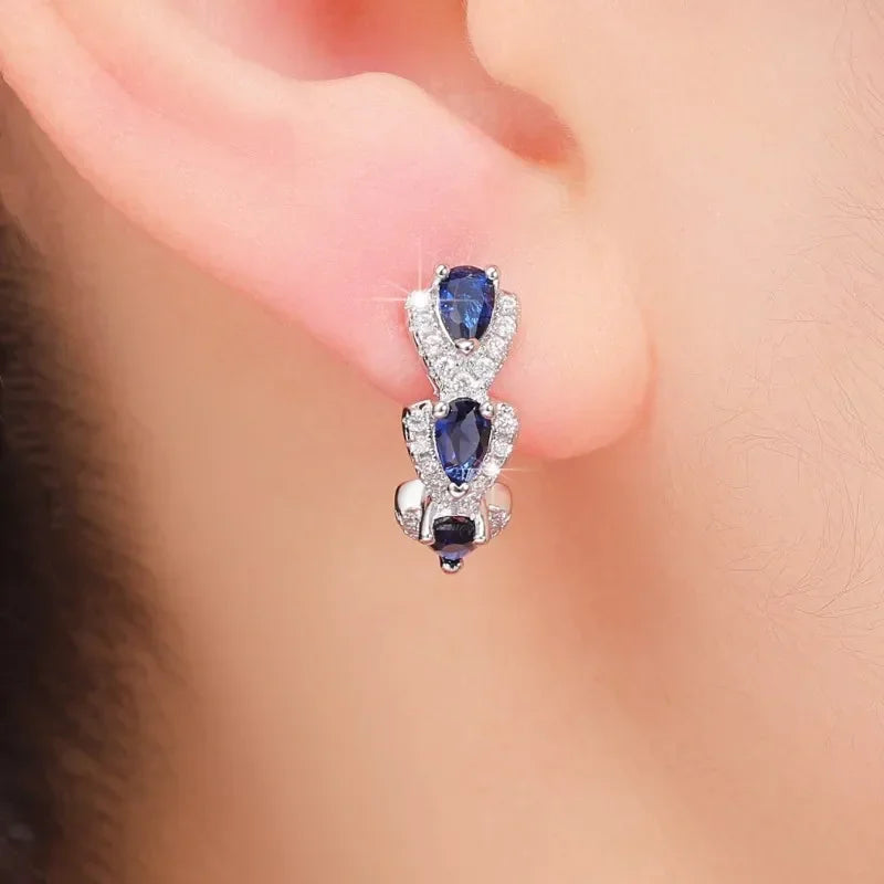 Aretes Zafiro Royal Crest | Oro blanco
