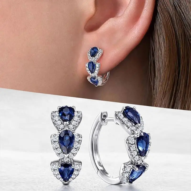 Aretes Zafiro Royal Crest | Oro blanco