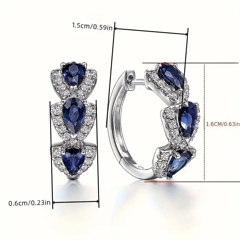 Aretes Zafiro Royal Crest | Oro blanco